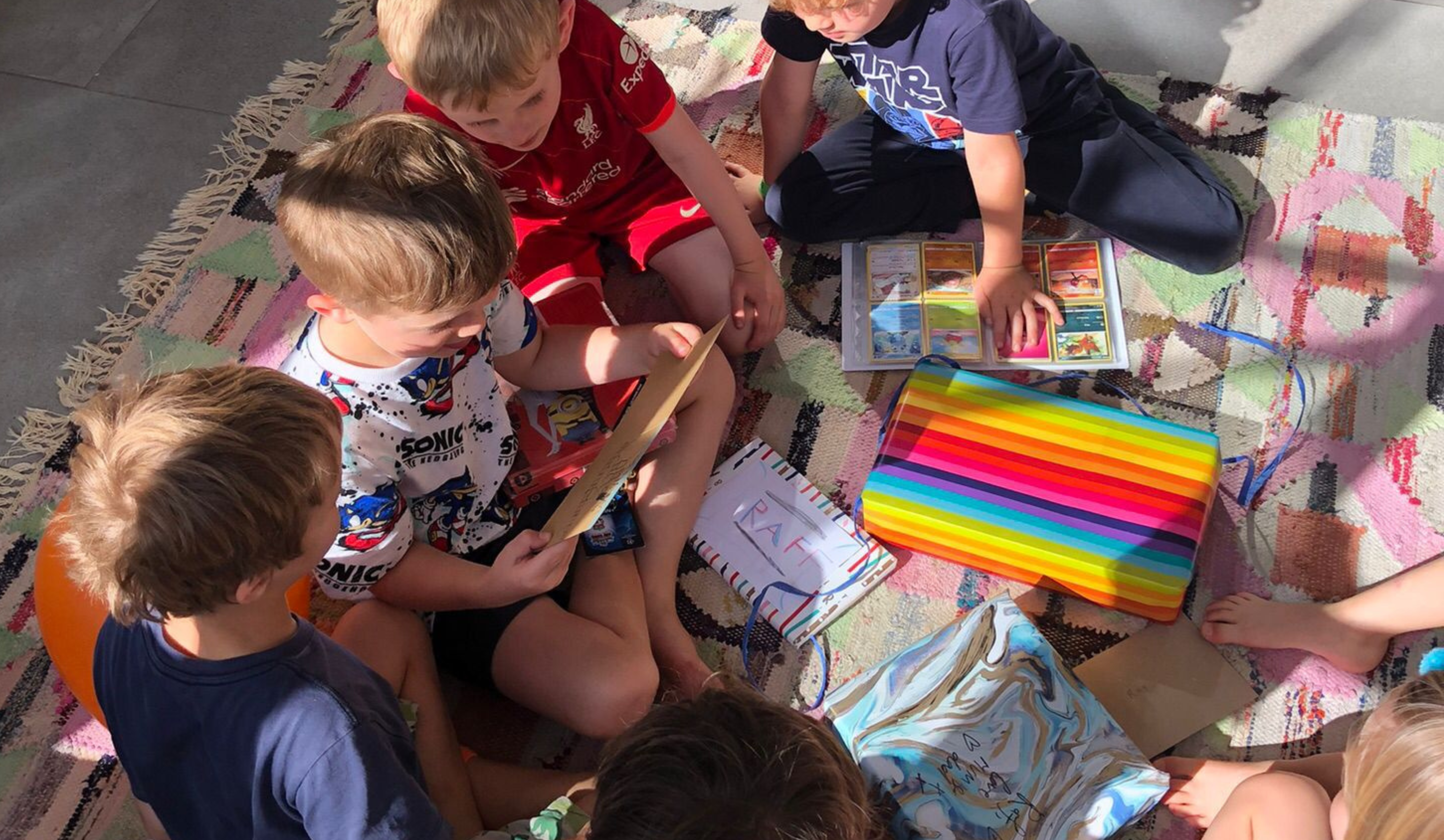 kids sitting round playing pass the parcel